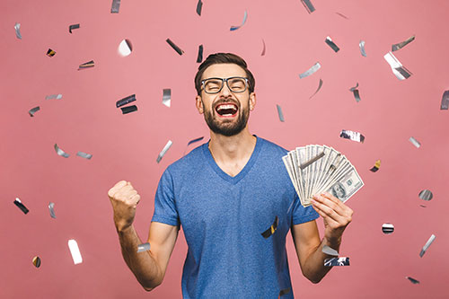 Man with cash and confetti