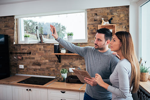 Couple looking at kitchen